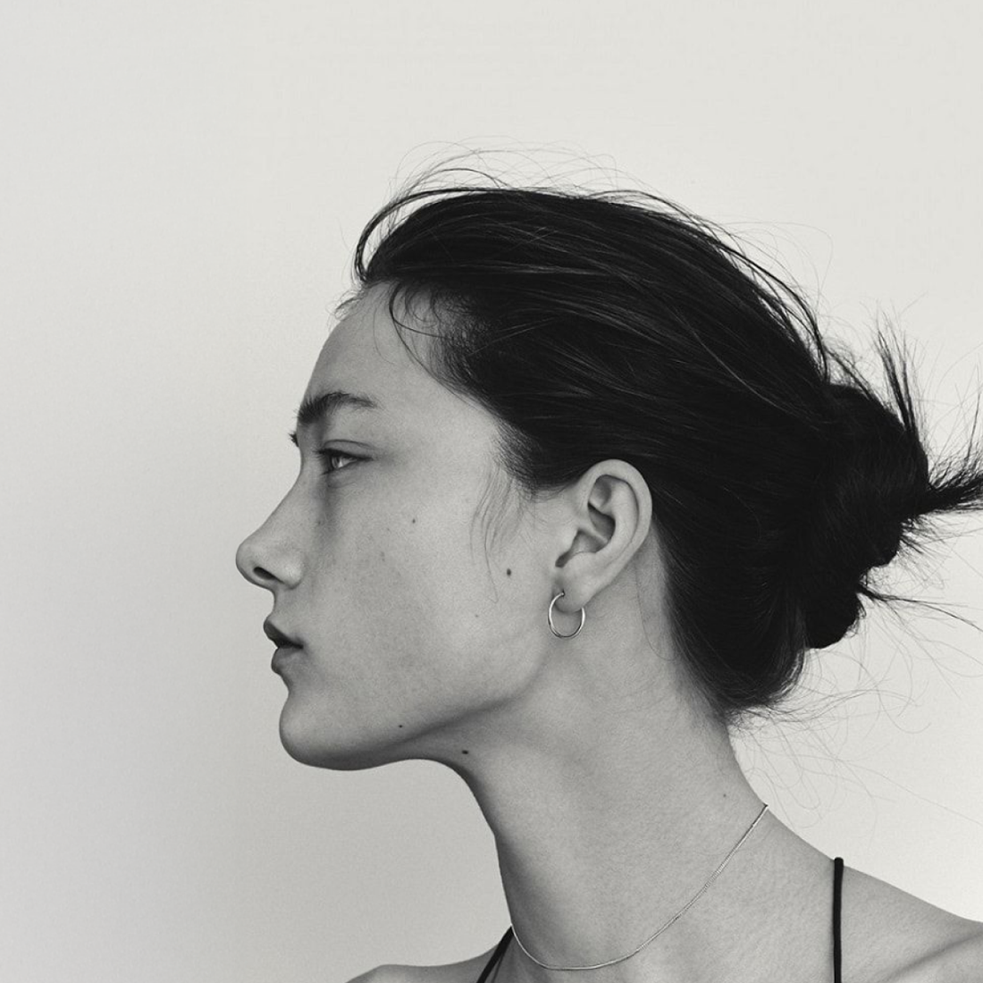A photographed profile echoing the mark